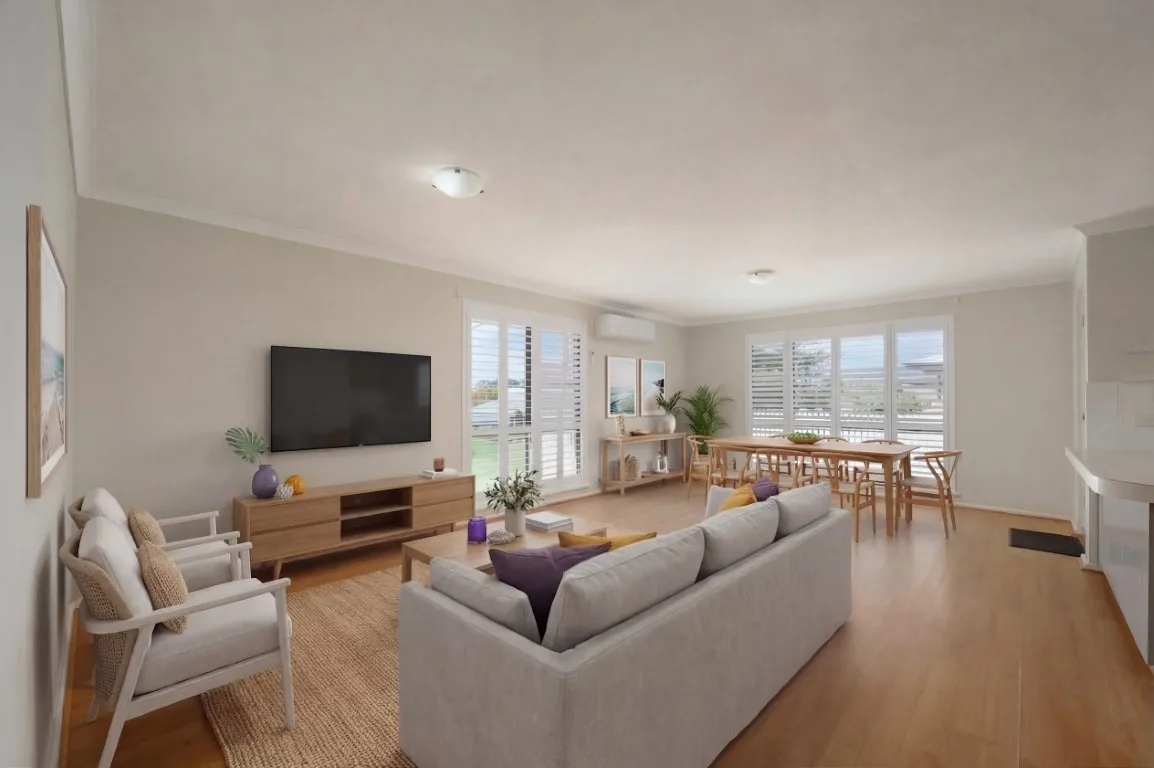 After photo of the same open-plan living area with virtual staging and enhanced presentation.